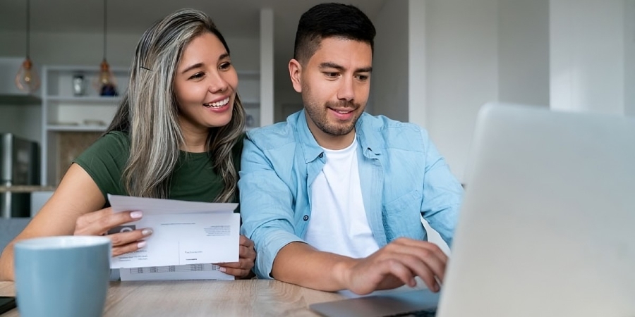 a couple looking at their energy savings online